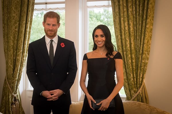 The Duke and Duchess of Sussex, Prince Harry and Meghan Markle, greeting guests at an official reception in 2018.